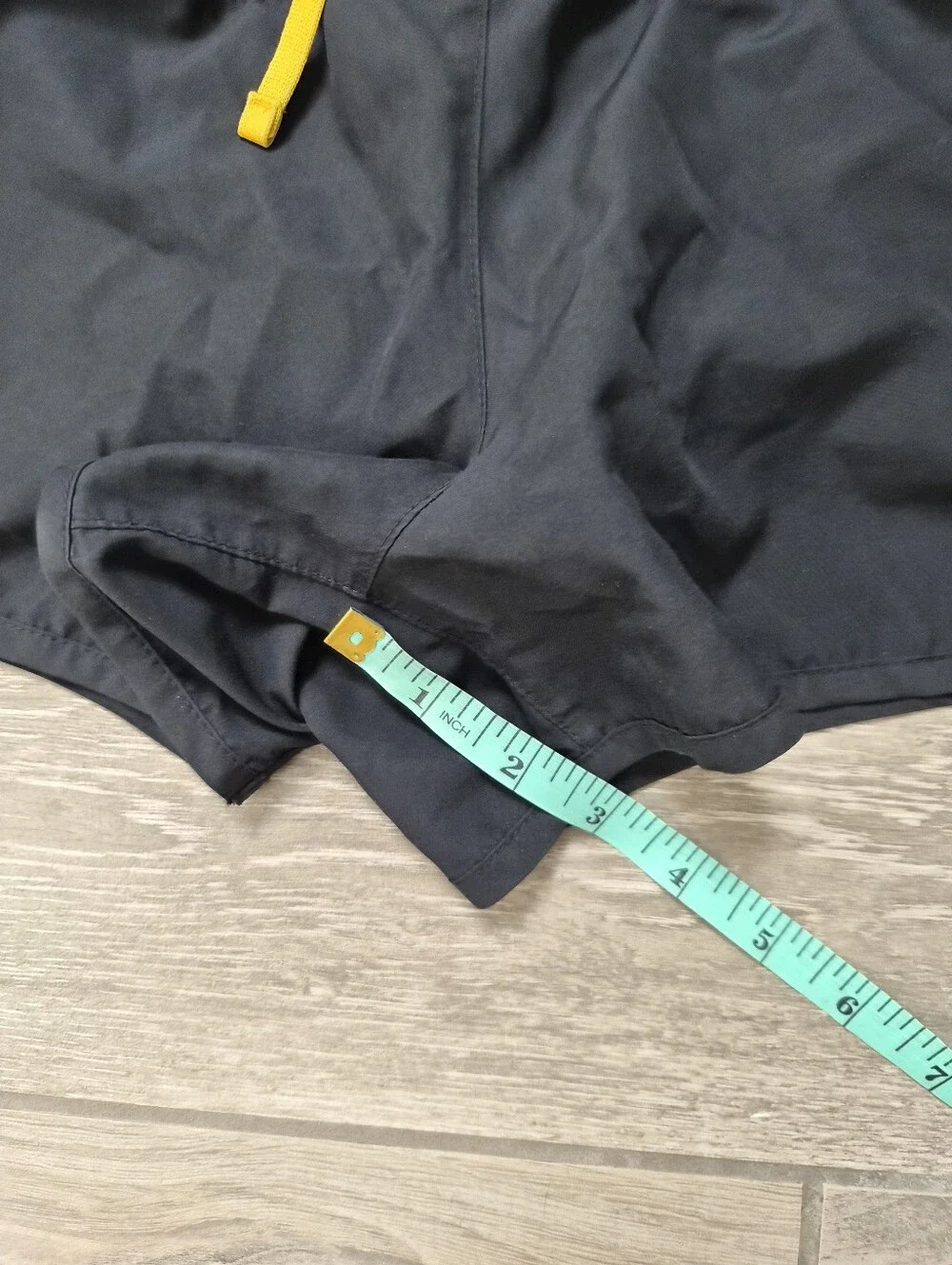Nike Black Athletic Shorts with Yellow Accents and Steelers Patch